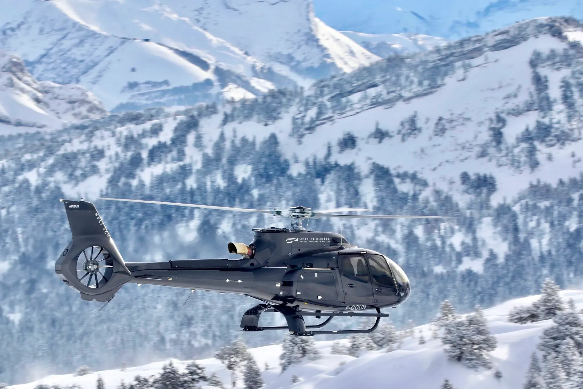 Helicopter over the snowy Alps