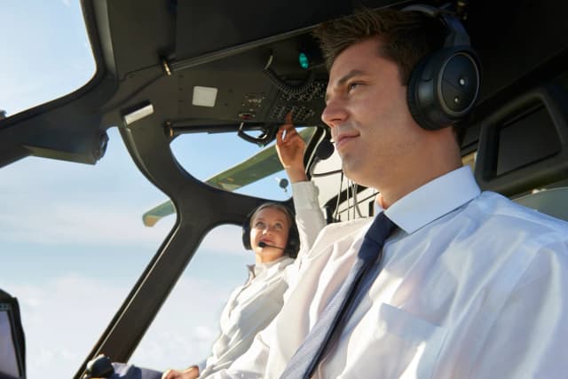 2 pilots in a helicopter cockpit